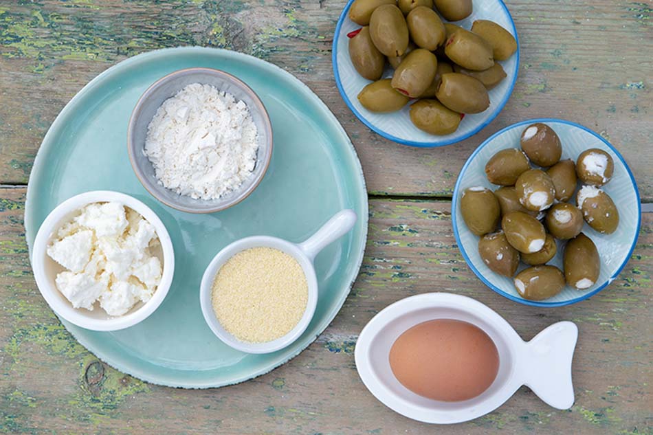 Deep - fried stuffed olives with ouzo dip